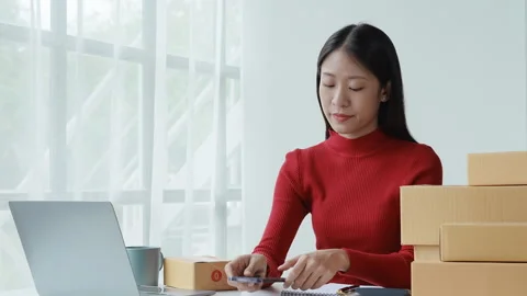 E-commerce, small business, sme , beautiful Asian woman expressing stress and Stock Footage 242737991