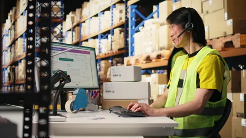 E-commerce support clerk responding to problems like lost parcels Stock Footage 313089211