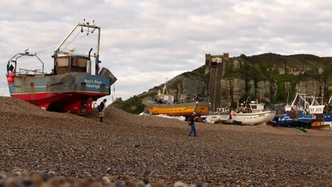 E Couple on beach with West Cliff Funicular background 4K Video stock 118510572