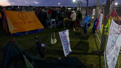 E Crowds attend 1980s re-enactment peace camp at Greenham Common 4K Stock Footage 116316243