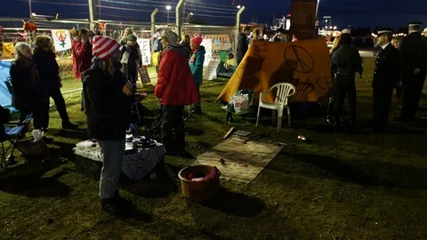 E Demonstrators sing at the peace camp at Greenham 4K Stock Footage 116374823