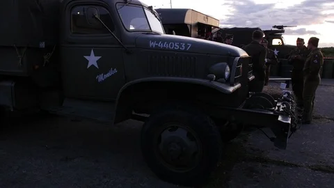 E A group of American 2nd world war soldiers next to army lorry 4K Stock Footage 116266055