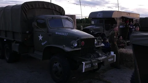 E A group of yank 2nd world war soldiers next to army vehicles 4K Stock Footage 116254832