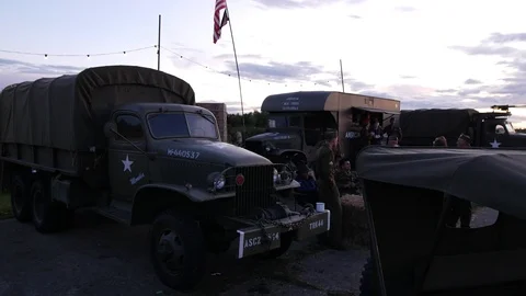 E A group of yank 2nd world war soldiers next to army vehicles slow motion 4K Stock Footage 116266489
