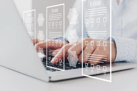 E learning and digital exam process taking place on a laptop in a home office Stock Photos