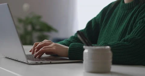 E-learning and distance education, closeup of hands of female student on Stock Footage 147314716
