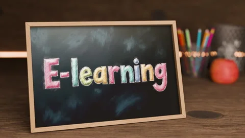 E Learning Chalkboard Display With Colorful Letters on Wooden Table Stock Footage 318989367