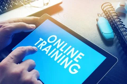 E-learning concept. Online training on a screen of tablet. Stock Photos