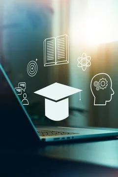 E learning concepts with laptop and educational symbols in a workspace during Stock Photos