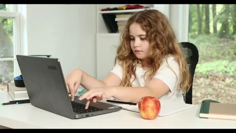 E-learning. Home learn for child. Kid learning on laptop e-learning. Teen Stock Footage 320869291