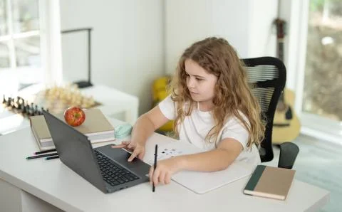 E-learning. Home learn for child. Kid learning on laptop e-learning. Teen Stock Photos