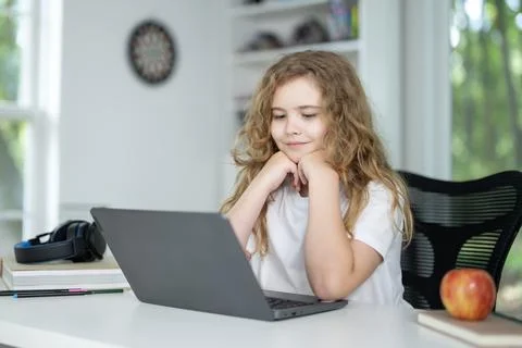E-learning. Home learn for child. Kid learning on laptop e-learning. Teen Stock Photos