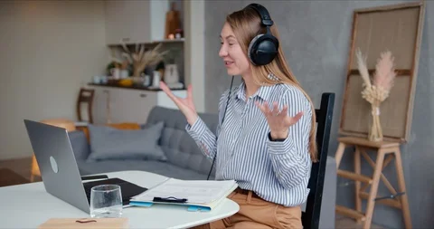 E-learning on self isolation. Happy young positive Caucasian tutor woman works Stock Footage 129274488