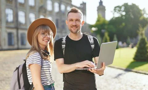 E-learning of students using laptop. Male and female studying 库存照片