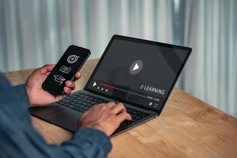 E-learning technology shows a person at an online course on a laptop and ph.. Fotos de archivo
