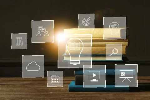 E learning tools and concepts represented with books and icons on a table in a Stock Photos