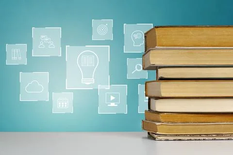 E learning tools and resources are represented with books and icons on a blue Stock Photos