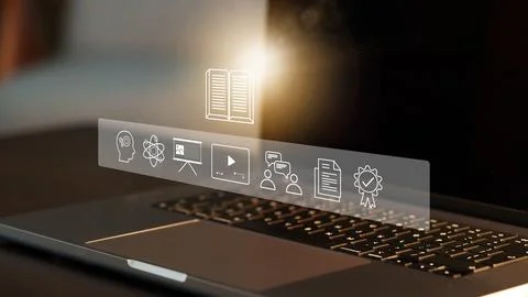 E learning tools on a laptop screen showing various educational icons and Stock Photos