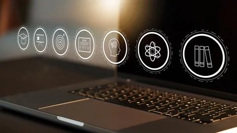 E learning tools on laptop screen with various educational icons and symbols Stock Photos