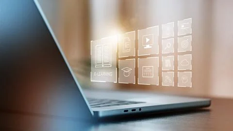 E-learning tools on a laptop screen in a workspace during daytime Stock Photos