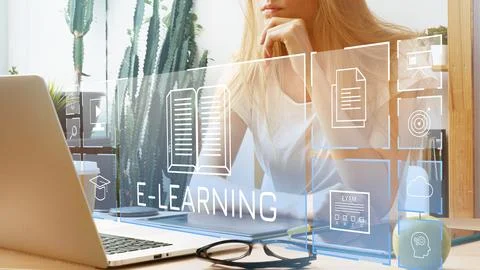 E learning tools used by a person working on a laptop at home with digital Stock Photos