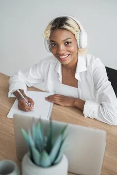 E-learning,online education concept.Happy smiling student in headphones looking Stock Photos