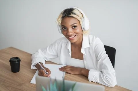 E-learning,online education concept.Happy smiling student in headphones looking Stock Photos