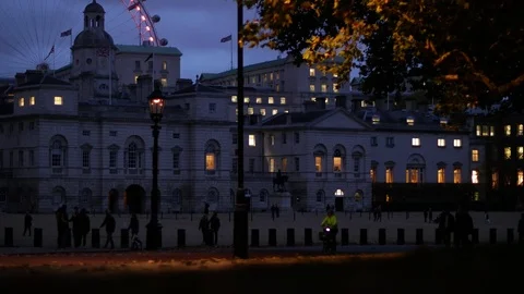 E Leaves blown in the wind whilst commuters head home in London 4K Video stock 124307871