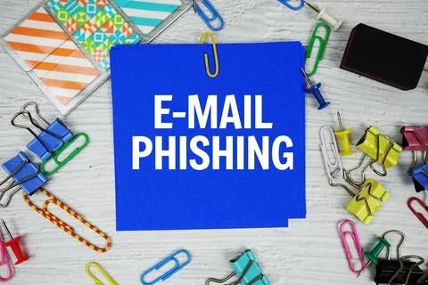 E-mail Phishing text on stick note with stationery on concrete background Stock Photos