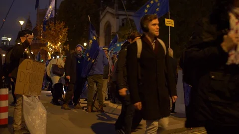 E Pro EU demonstraters mingle with Londoncrowds at night slow motion 4K Stock Footage 122235333