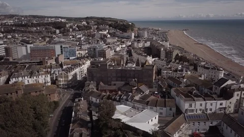 E Rising drone shot of built up area of Hasting in England aerial 4K Stock Footage 117137107