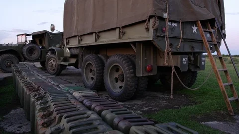 E S A line of fuel tanks and US 2nd world war vehicles 4K Stock Footage 116355336