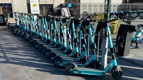 E scooters are seen in a charging station in Istanbul, Turkey 4K Stock Footage 166701772
