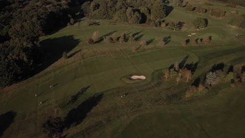 E Tree shadows on a Golf course in the UK aerial. 4K Stock Footage 123697993