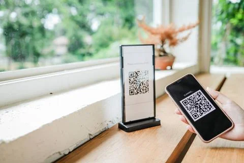E wallet Qr code payment. Woman scanning QR code online shopping cashless ... Stock-Fotos
