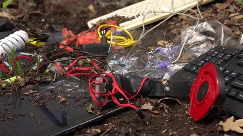 E-waste in a landfill. Electronic pollution. Electrical equipment toxic scrap Stock Footage 136448355
