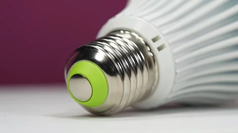 E27 base of large white LED lamp, close-up shot video Stock Footage 330901193