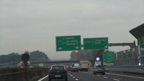 E45 a1 napoli a3 salerno reggio c green white sign on above highway with down Video stock 252148299