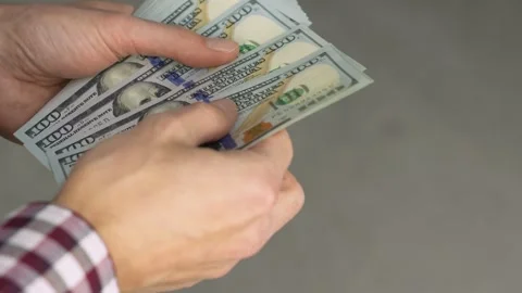 Each bill becomes a step towards financial success hands confidently recalculate Stock Footage 252131458