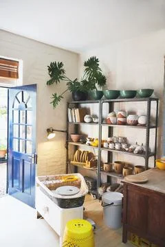 Each piece is as unique as the next. various vases and pots on a shelf in a Stock Photos