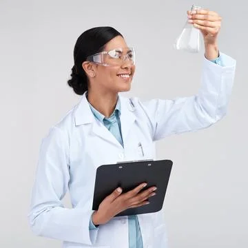 Each solution reveals different results. an attractive young female scientist Stock Photos
