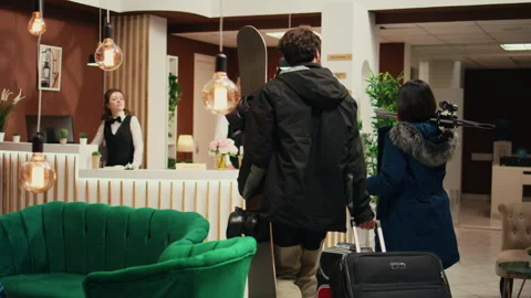 Eager guests enter at ski lodge Video stock 254409682