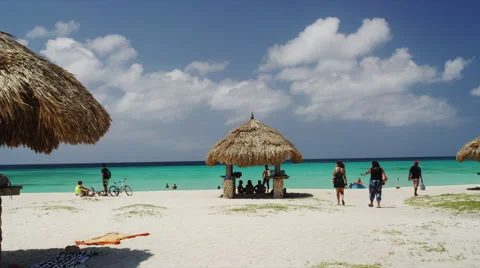 Eagle Beach with Sunseekers and Native Beach Umbrella 스톡 동영상 52233772