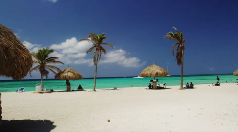 Eagle Beach with Sunseekers and Native Beach Umbrella Stock Footage 52234450