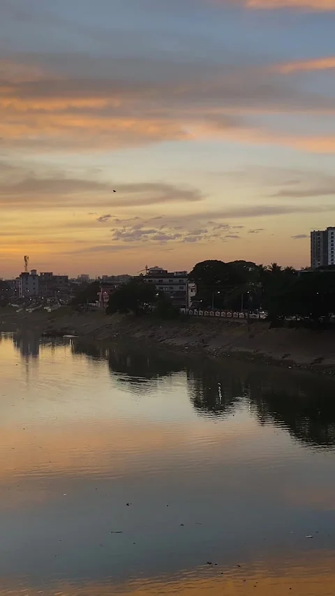 Eagle Birds Flying Over Surma River With Garbage On The Riverbank During Sunset Stock Footage 318119730