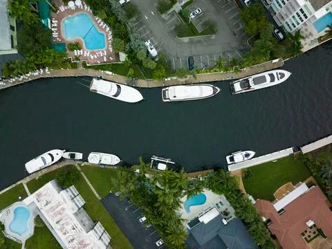Eagle eye view of river with many boats and yachts docked in florida Stock Photos