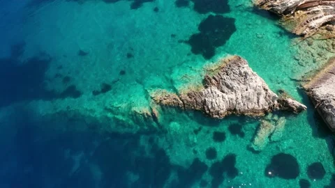 Eagle eye view of waves crushing on rocks in turquoise sea at Ithaca Greece Stock Footage 164618692