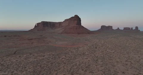 Eagle Mesa and buttes under pink sky in Monument Valley Utah Stock Footage 346650936