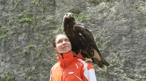 Eagle on the shoulder of the girl Stock Footage 63370231