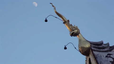 Eagle Statue and Moon at an Ornate Thai Buddhist Temple Stock-Footage 333705391